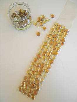 2. Position the glass nuggets face down on the mounting sheet. Make sure all the pieces stick firmly.